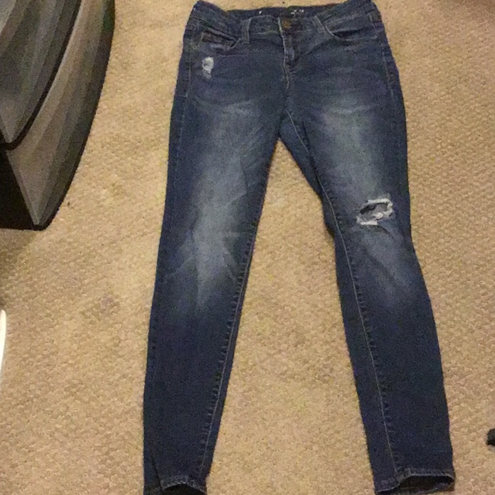 Ripped dark blue jeans